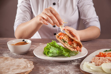 Chef hands stuffed tacos