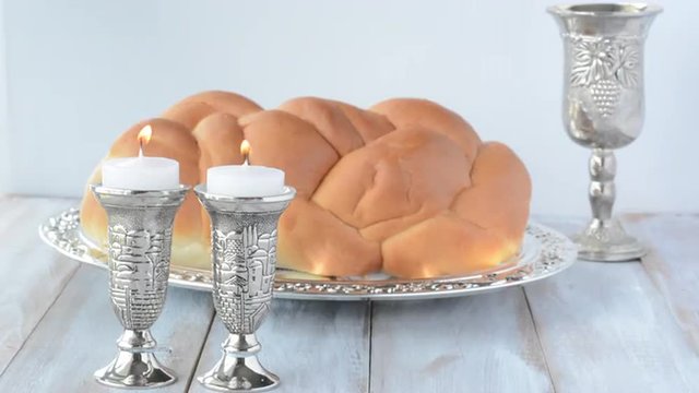 Shabbat candles with Challah bread and wine