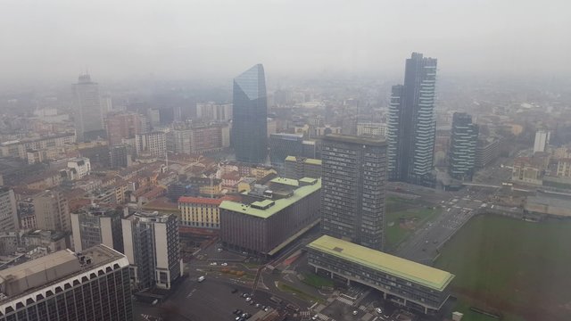From the bottom to the top aerial panoramic view of Milan skyline with office bilding and apartment
