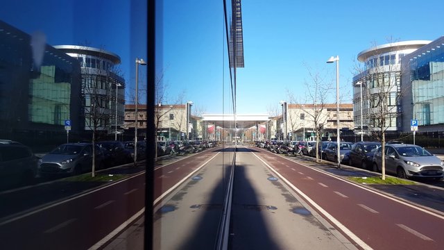View of a street reflected in a building with mirror windows with no one &ndash; alone, isolated concept