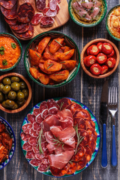 Typical spanish tapas concept, rustic style,  top view.