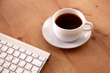 Office table with blank notepad and laptop 