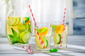 Fresh lemonade with fruits with in sunny day