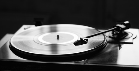 Vintage record player with vinyl disc, close-up