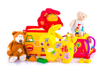 Children multicolored toys on bright yellow background