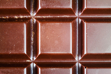 Dark chocolate bar, top view, close-up