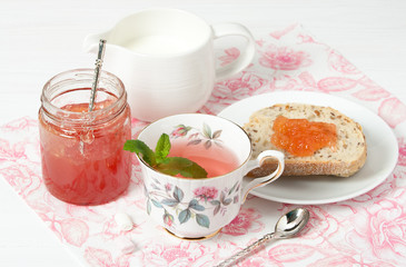 Watermelon Jam, Herbal Tea, Marshmallows. White Wooden Table