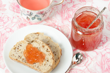 Watermelon Jam, Herbal Tea, Marshmallows. White Wooden Table