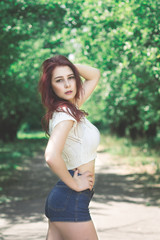 Fototapeta premium sexy young woman in lingerie in a park