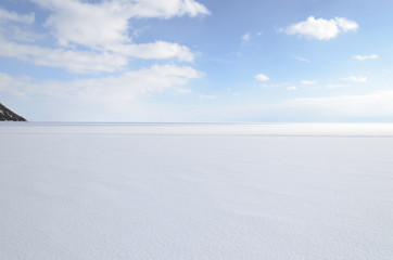 Smooth surface of snowy frozen Baikal
