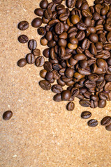 Coffee beans on a cork background