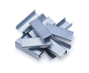 Stack of metal staples isolated on a white background.