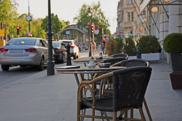 Outdoor cafe. Little tables of cafe on the street of Vienna.