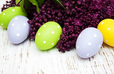 easter eggs and fresh lilac flowers