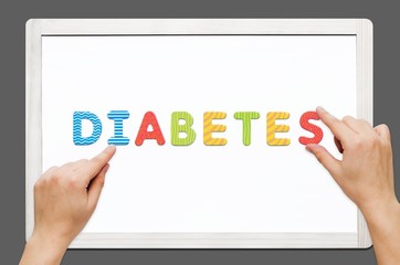 Hands put the word Diabetes with magnetic letters