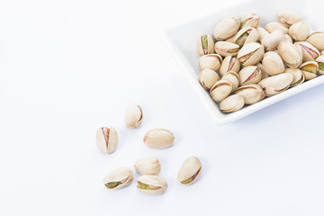 Pistachio nuts on dish