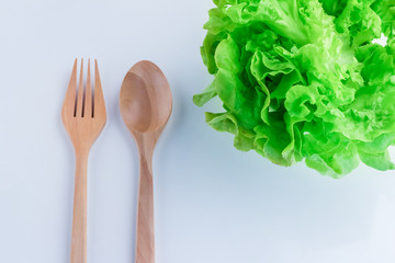 healthy food concept with fresh lettuce and wooden spoon and for
