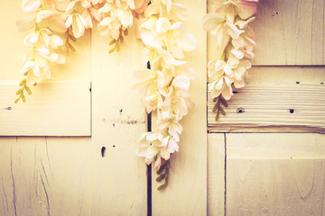 Rose flowers decorate with wood door for background, vintage ton