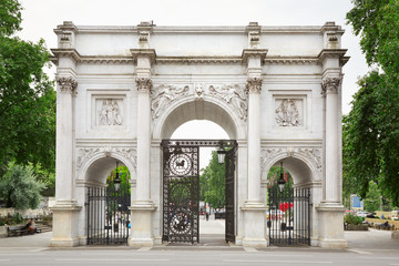 Marble Arch with green tree branches in London