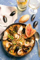 Traditional seafood paella in the pan