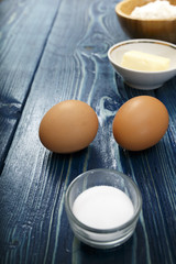 fresh eggs in an old blue table