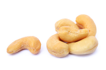 Peeled salted cashews isolated on a white background