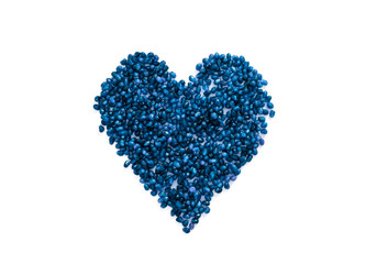 Blue berries of a pomegranate in a heart shape