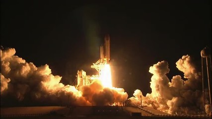 The Space Shuttle Lifts off from its launchpad.