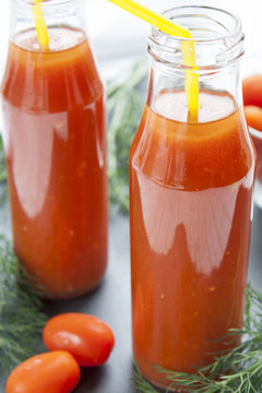 Natural and fresh tomato juice in small bottles