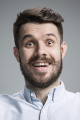 Fototapeta premium Portrait of young man with shocked facial expression