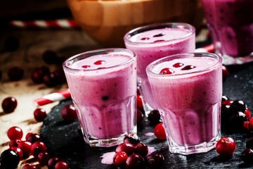 Pink smoothies with milk, black currants and cranberries, fresh
