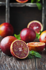 Sweet red oranges on the wooden table