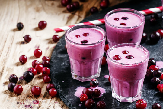 Pink smoothies with milk, black currants and cranberries, fresh