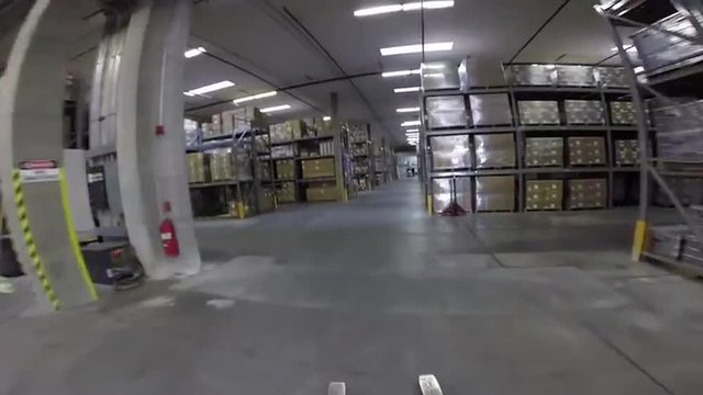High speed POV shot traveling through a large warehouse facility.