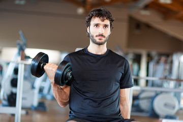 Fototapeta na wymiar Fit Athlete Working Out Biceps