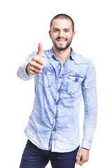 Young casual man thumbs up over white background