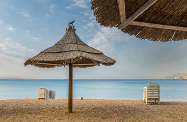 Morning view on sandy beach of Eilat - famous resort and recreation city in Israel