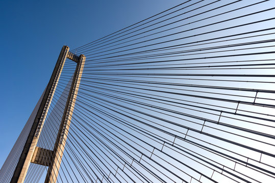 Fototapeta bridge steel ropes constructions on sky  background