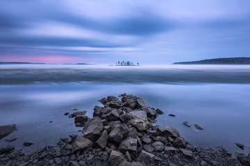 Fototapeta premium Spring, mist over the lake