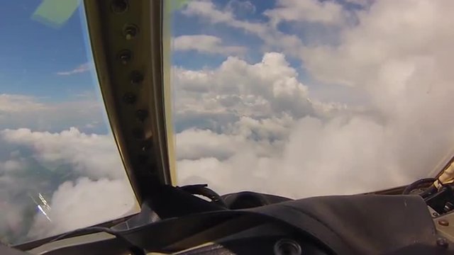 POV shot of flying through clouds from a C-130 cargo plane.