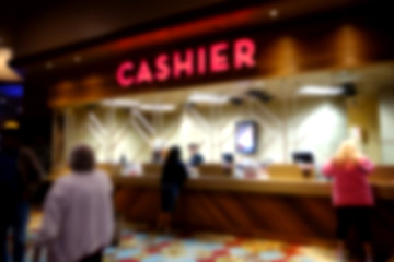 Naklejka premium blurred background of cashier cage at casino