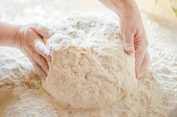 Woman is preparing dough 