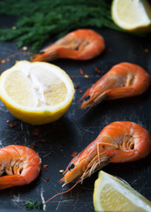 Fresh shrimp in the shell with a lemon, spices and herbs