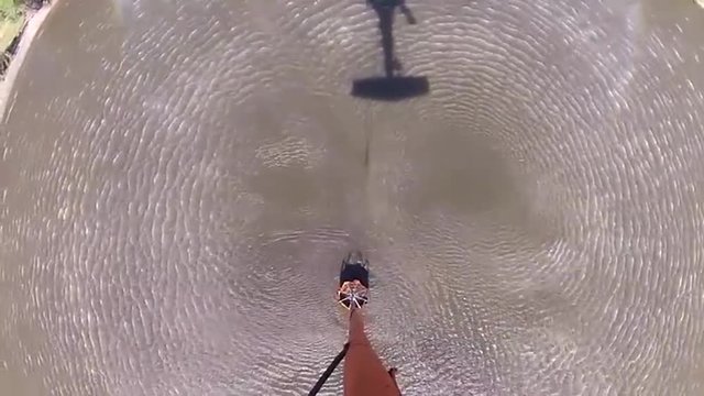 POV from a water dropping helicopter flying over a fire.