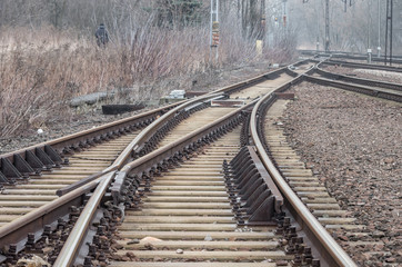 Railway track on gravel embankment, with concrete railway ties