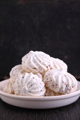 meringue cake with chocolate in a black background