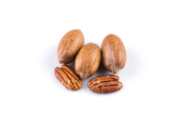 Few pecan nuts isolated on white