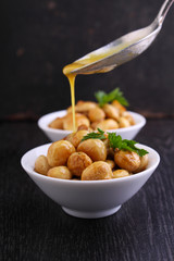 fried mushrooms(champignon) with the marinade of mustard, honey and garlic