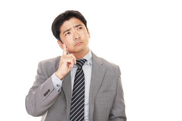 悩むビジネスマン