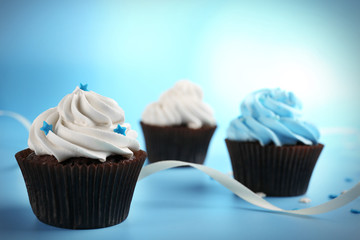Chocolate cupcakes on blue background